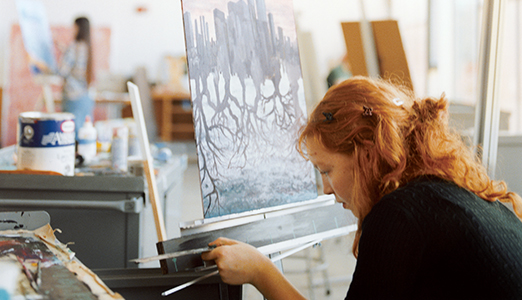 Student working in a painting studio.